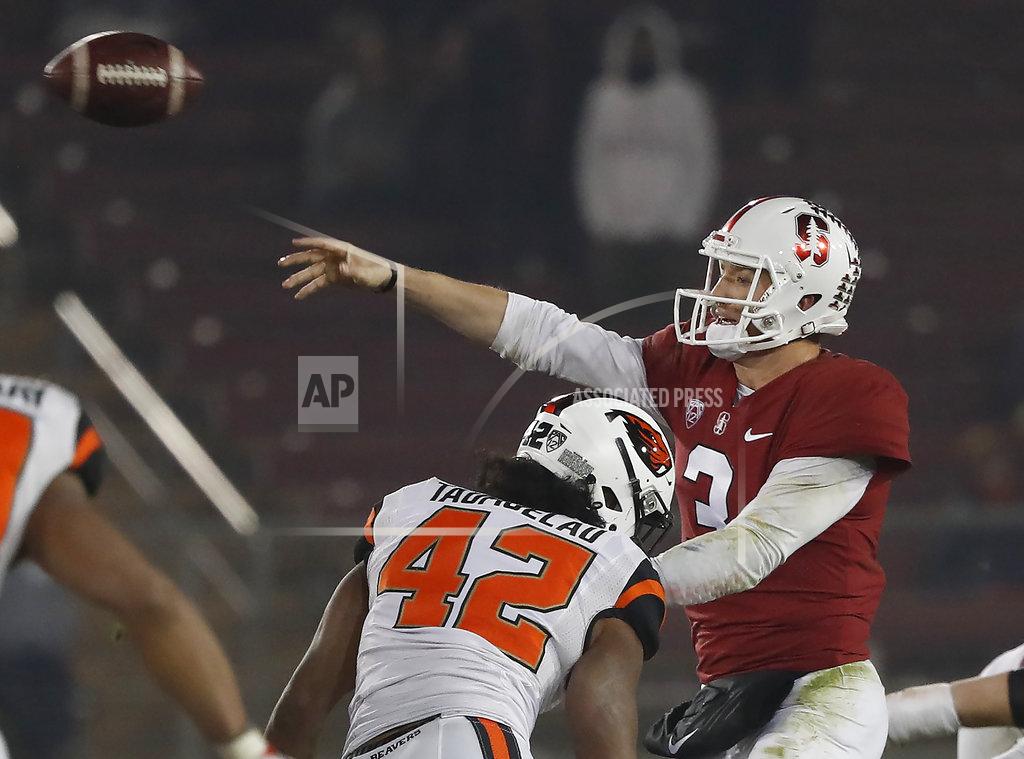 Tony Avelar Stanford quarterback K.J. Costello (3) throws a pass under pressure by Oregon State linebacker Doug Taumoelau (42) in the second half during an NCAA college football game on Saturday, Nov. 10, 2018, in Stanford, Calif. Stanford won 48-17. (AP Photo/Tony Avelar)