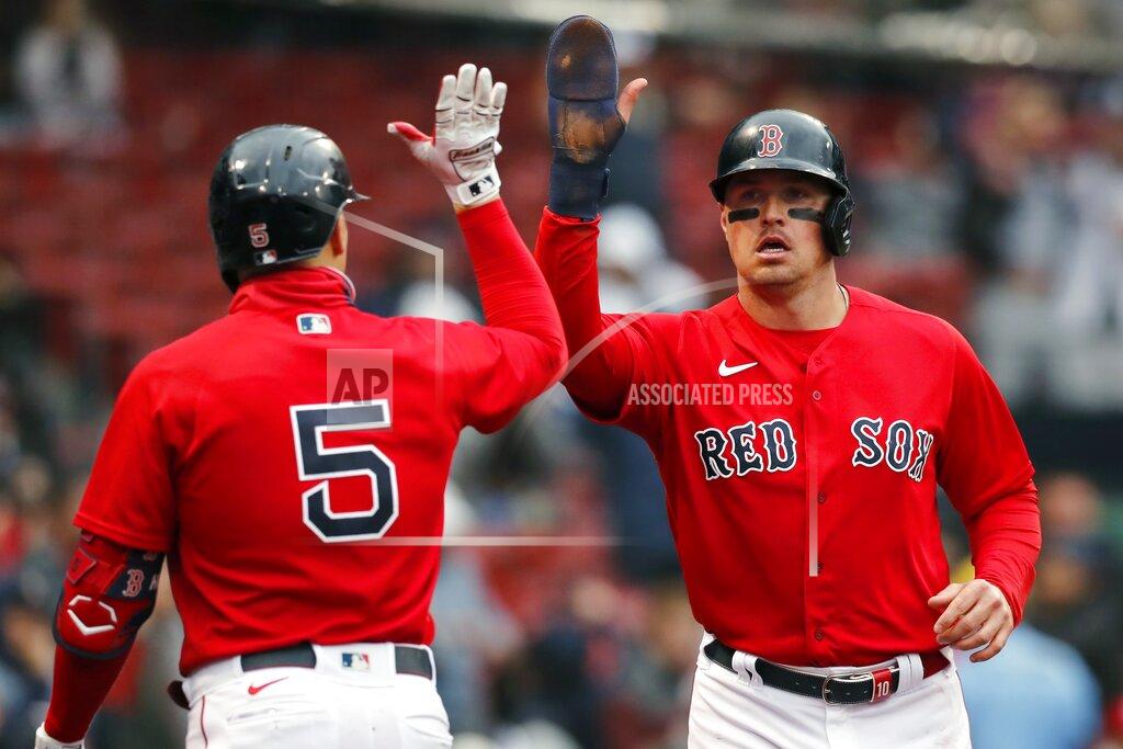 Michael Dwyer Boston Red Sox's Hunter Renfroe celebrates with Enrique Hernandez (5) after scoring on a single by Kevin Plawecki during the fourth inning of a baseball game against the Miami Marlins, Saturday, May 29, 2021, in Boston. (AP Photo/Michael Dwyer)