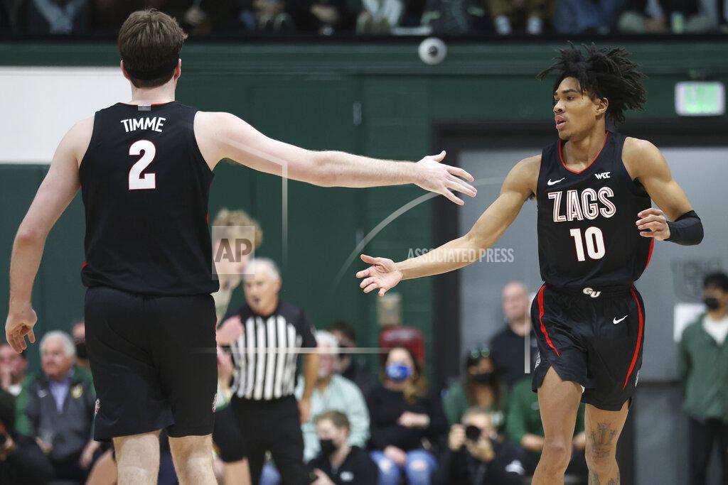 Jed Jacobsohn Gonzaga guard Hunter Sallis (10) is congratulated by teammate Drew Timme (2) after scoring against San Francisco during the first half of an NCAA college basketball game in San Francisco, Calif., Thursday, Feb. 24, 2022. (AP Photo/Jed Jacobsohn)