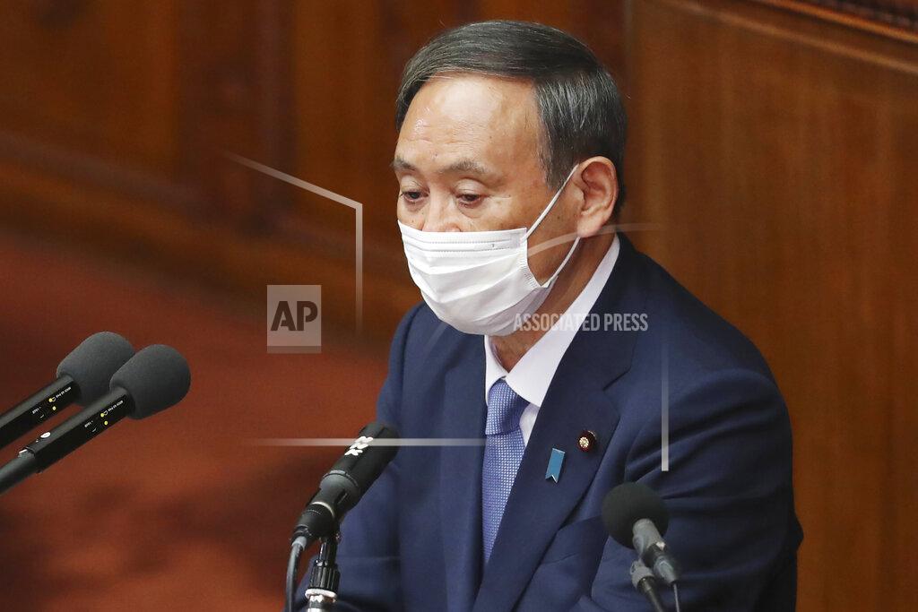 Koji Sasahara Japanese Prime Minister Yoshihide Suga delivers a policy speech during an extraordinary Diet session at the upper house of parliament in Tokyo, Monday, Oct. 26, 2020. Suga has declared Japan will achieve zero carbon emissions by 2050 in his first policy speech after taking over from Shinzo Abe. The policy speech Monday at the outset of the parliamentary session set an ambitious agenda reflecting Suga's pragmatic approach to getting things done. (AP Photo/Koji Sasahara)