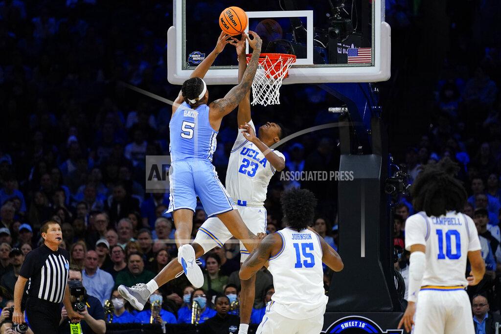 Matt Rourke North Carolina's Armando Bacot (5) cannot get a shot past UCLA's Peyton Watson (23) during the first half of a college basketball game in the Sweet 16 round of the NCAA tournament, Friday, March 25, 2022, in Philadelphia. (AP Photo/Matt Rourke)