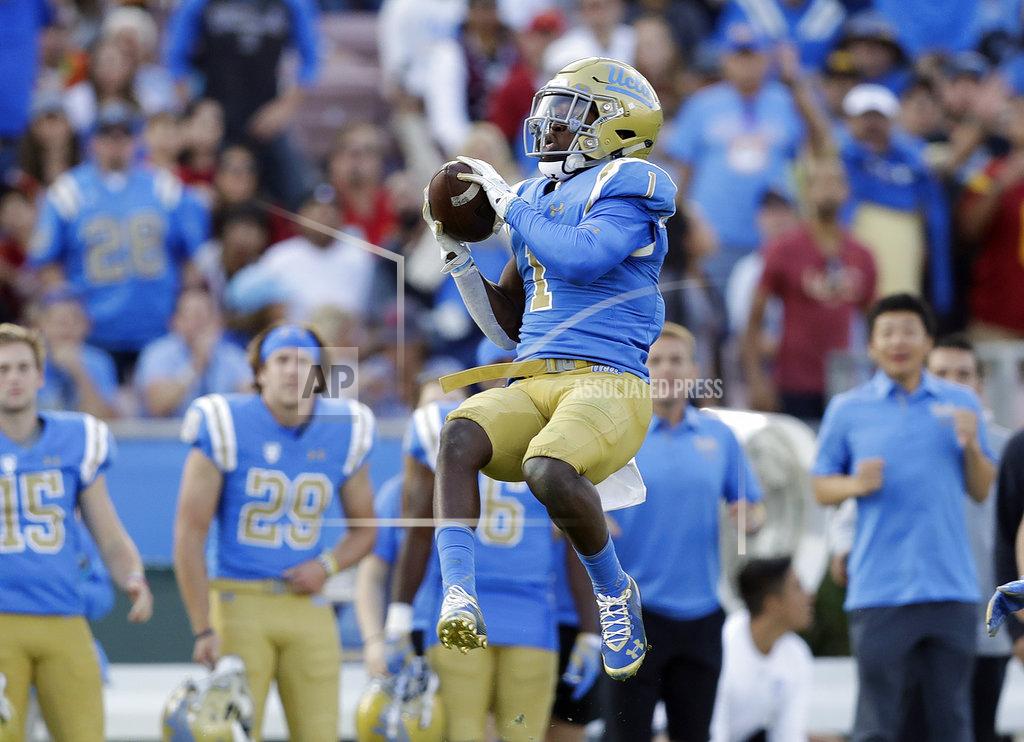Marcio Jose Sanchez UCLA defensive back Darnay Holmes (1) intercepts a pass from Southern California quarterback JT Daniels during the second half of an NCAA college football game Saturday, Nov. 17, 2018, in Pasadena, Calif. (AP Photo/Marcio Jose Sanchez)