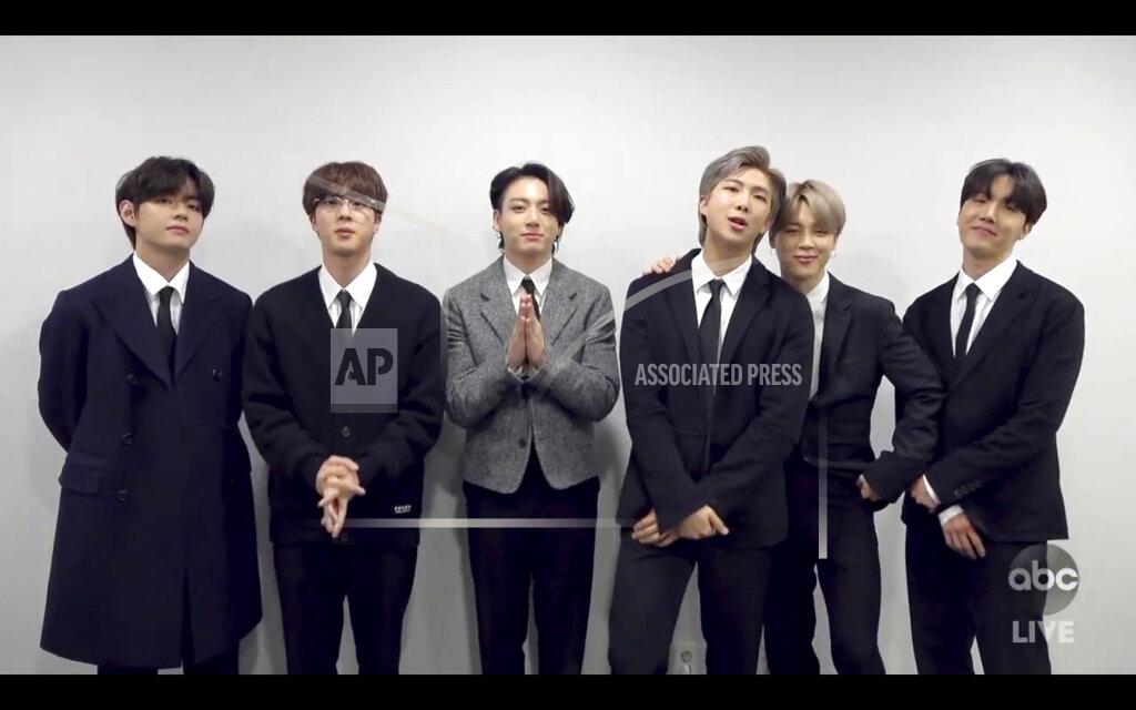 Uncredited In this screen shot provided by ABC on Sunday, Nov. 22, 2020, BTS accepts the award for favorite pop/rock duo or group at the American Music Awards at the Microsoft Theater in Los Angeles. (ABC via AP)