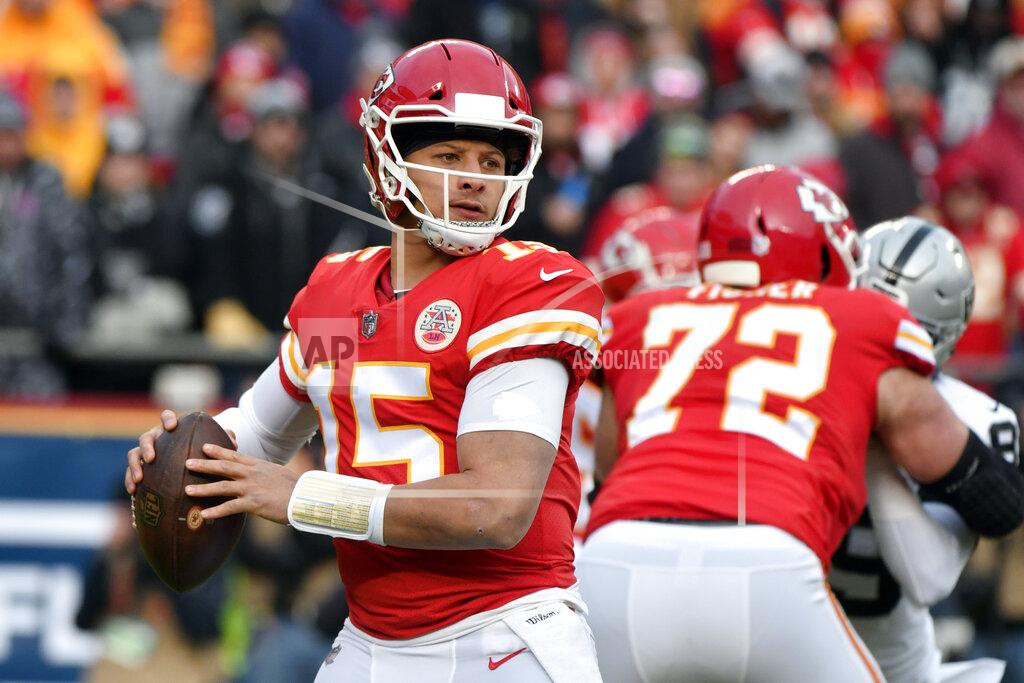 Ed Zurga FILE - In this Dec. 30, 2018 file photo Kansas City Chiefs quarterback Patrick Mahomes (15) looks for a receiver during the first half of an NFL football game against the Oakland Raiders in Kansas City, Mo. The Chiefs have never beaten Indianapolis in four tries in the playoffs. They will try to end that era of heartache in the divisional round on Saturday, Jan. 12, 2019. Patrick Mahomes and the Chiefs’ record-setting offense may have to outscore Andrew Luck and the Colts, who hope to put up big numbers against a suspect Kansas City defense at Arrowhead Stadium. (AP Photo/Ed Zurga, file)