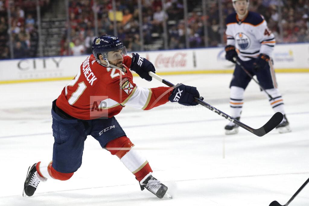 Lynne Sladky FILE - In this Feb. 15, 2020, file photo, Florida Panthers center Vincent Trocheck (21) shoots on the goal during the first period of an NHL hockey game against the Edmonton Oilers, in Sunrise, Fla. The Panthers traded Trocheck to the Carolina Hurricanes for Erik Haula, Lucas Wallmark and prospects Chase Priskie and Eetu Luostarinen, Monday, Feb. 24, 2020. (AP Photo/Lynne Sladky, File)