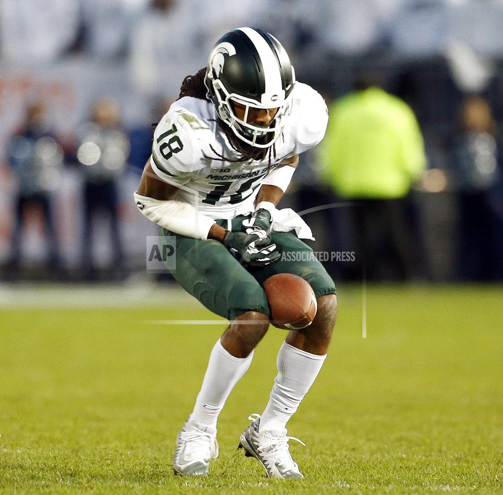 Chris Knight Michigan State's Felton Davis (18) catches a pass between his knees during the second half of an NCAA college football game against Penn State in State College, Pa., Saturday, Oct. 13, 2018. (AP Photo/Chris Knight)