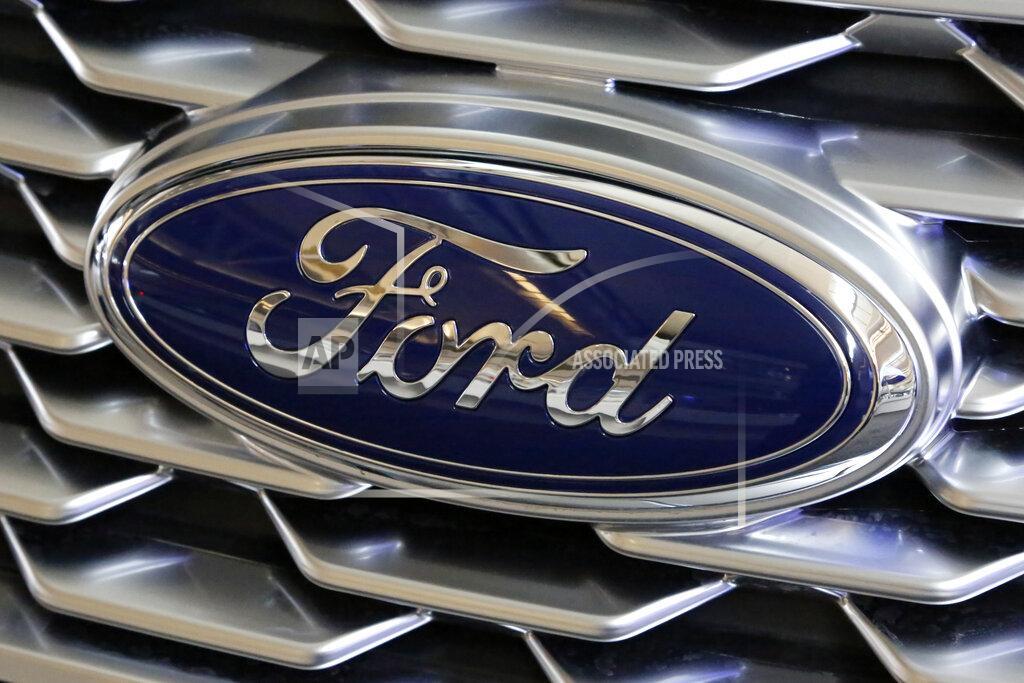 Gene J. Puskar FILE- This Feb. 15, 2018, file photo shows a Ford logo on the grill of a 2018 Ford Explorer on display at the Pittsburgh Auto Show. Edsel B. Ford II is retiring from the board of Ford Motor after serving as a board member for 33 years. The automaker also named some other members of the famous family as board nominees. Board nominees will be up for election at Ford's annual meeting on May 13, 2021. (AP Photo/Gene J. Puskar, File)