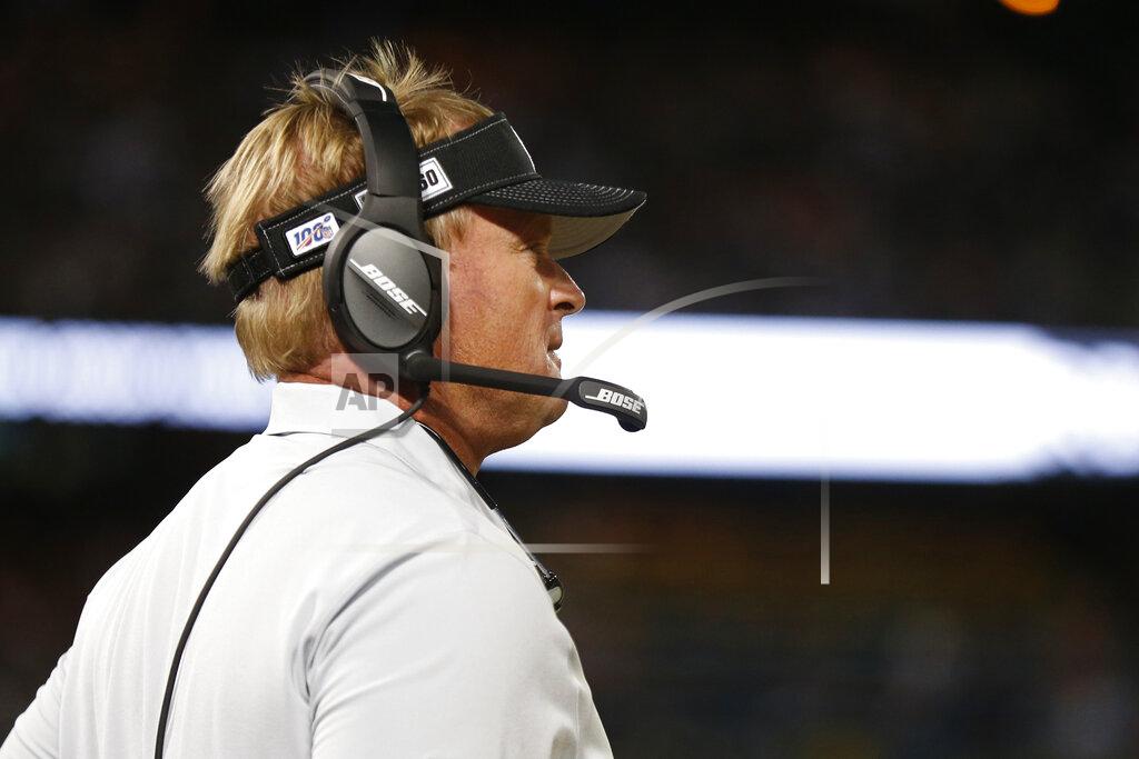 D. Ross Cameron Oakland Raiders head coach Jon Gruden stands on the sidelines during the first half of an NFL football game against the Denver Broncos Monday, Sept. 9, 2019, in Oakland, Calif. (AP Photo/D. Ross Cameron)