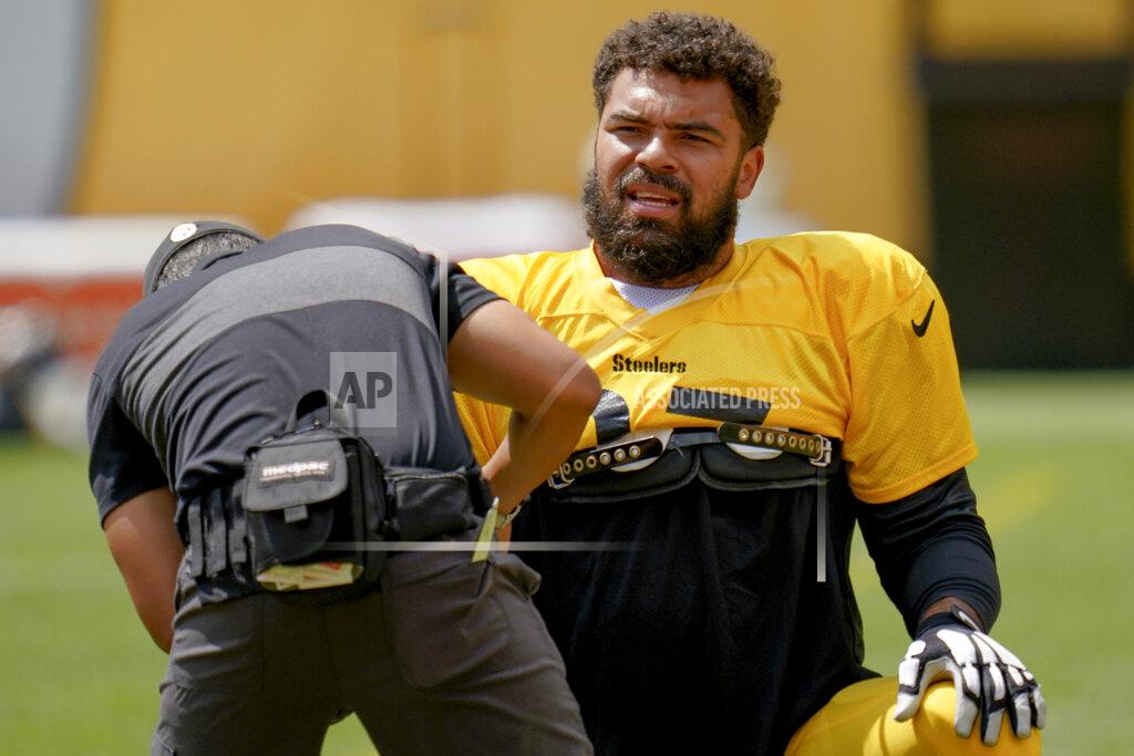 Keith Srakocic Pittsburgh Steelers defensive tackle Cameron Heyward (97) has his equipment adjusted during an NFL football training camp practice, Monday, Aug. 24, 2020, in Pittsburgh. (AP Photo/Keith Srakocic)