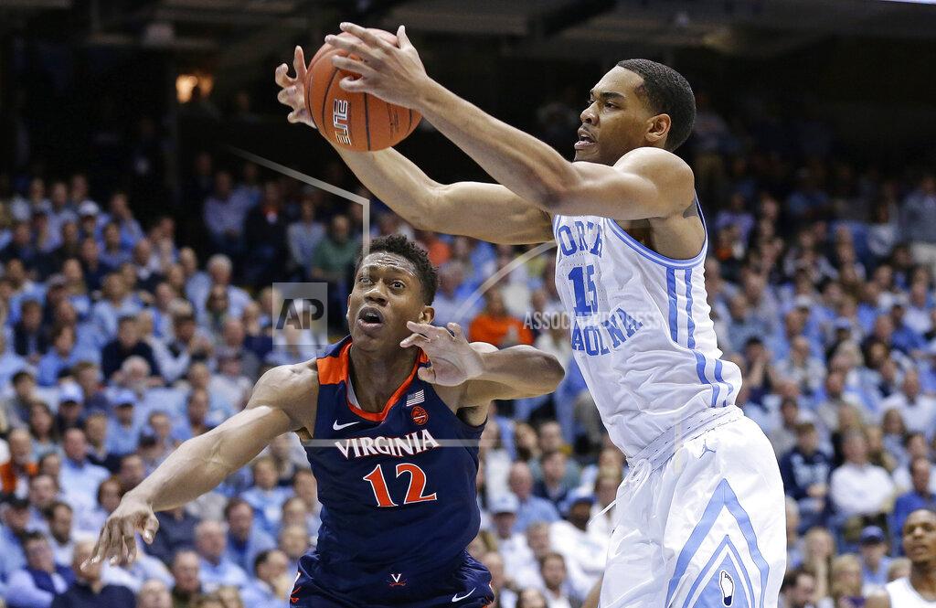 Gerry Broome North Carolina's Garrison Brooks (15) and Virginia's De'Andre Hunter (12) reach for a rebound during the first half of an NCAA college basketball game in Chapel Hill, N.C., Monday, Feb. 11, 2019. (AP Photo/Gerry Broome)