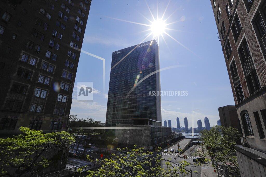 Sparse traffic due to coronavirus, moves past the United Nations headquarters Friday, May 15, 2020, New York. (AP Photo/Frank Franklin II)