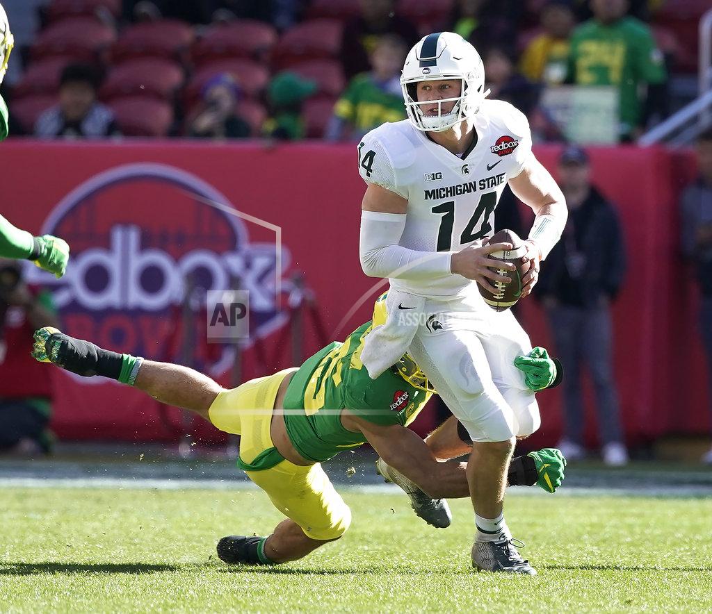 Tony Avelar Michigan State quarterback Brian Lewerke (14) is sacked by Oregon safety Brady Breeze (25) during the first half of the Redbox Bowl NCAA college football game Monday, Dec. 31, 2018, in Santa Clara, Calif. (AP Photo/Tony Avelar)