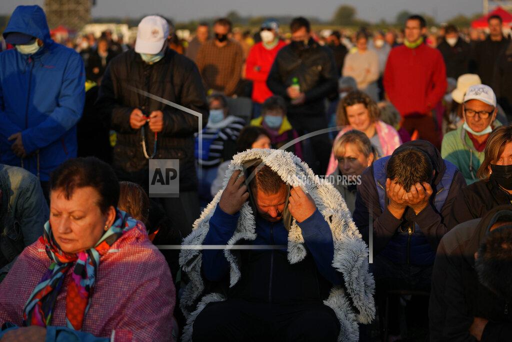Petr David Josek Faithful wait for Pope Francis arrival in the esplanade of the National Shrine in Sastin, Slovakia, Wednesday, Sept. 15, 2021. Pope Francis is to hold an open air mass in Sastin near the Slovakian capital on Wednesday, the site of an annual pilgrimage each September 15 to venerate Slovakia's patron, Our Lady of Sorrows. (AP Photo/Petr David Josek)