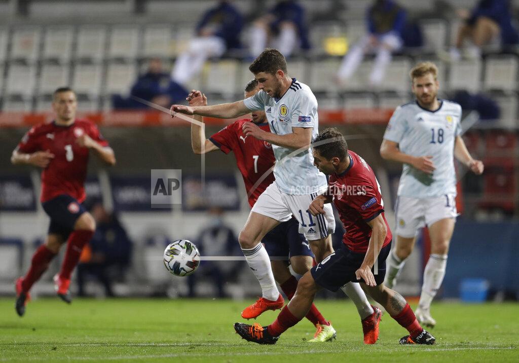 Petr David Josek Scotland's Ryan Christie, centre controls the ball, as Czech Republic's players try to stop him, during the UEFA Nations League soccer match between Czech Republic and Scotland in Olomouc, Czech Republic, Monday, Sept. 7, 2020. (AP Photo/Petr David Josek)