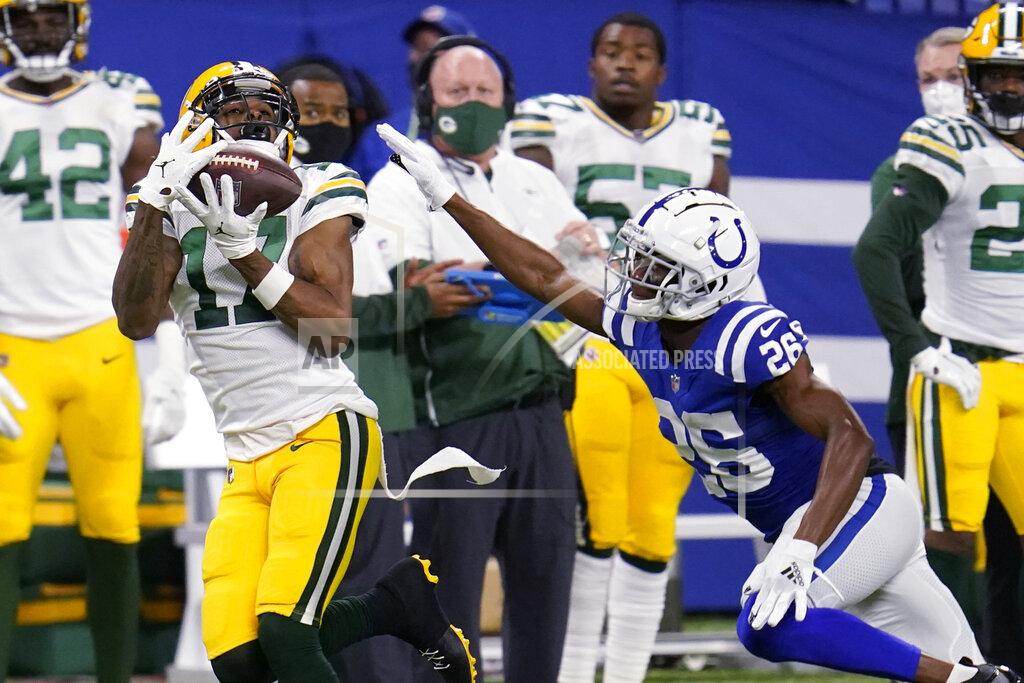 Michael Conroy Green Bay Packers' Davante Adams (17) makes a catch against Indianapolis Colts' Rock Ya-Sin (26) during the first half of an NFL football game, Sunday, Nov. 22, 2020, in Indianapolis. (AP Photo/Michael Conroy)