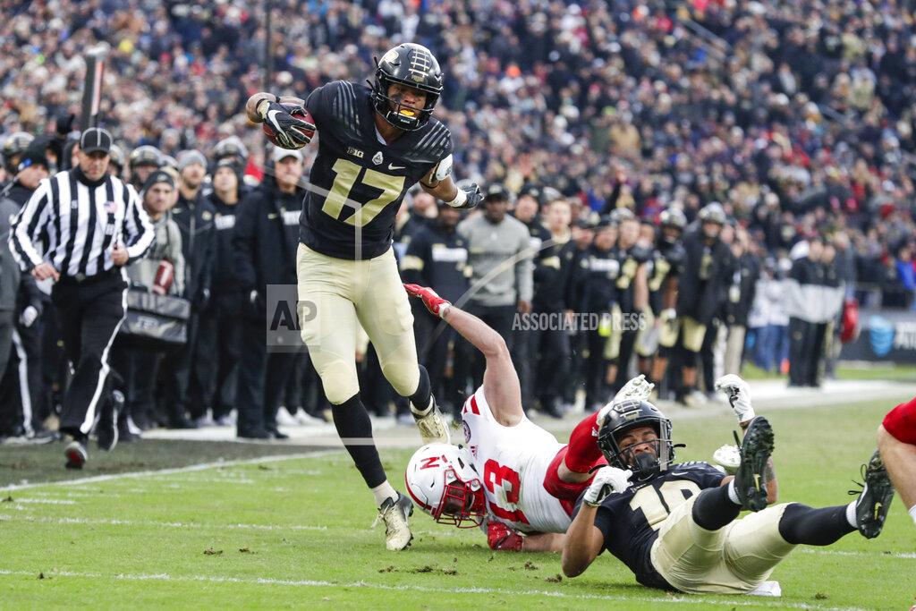 Michael Conroy Purdue cornerback Byron Perkins (17) is tripped up by Nebraska linebacker JoJo Domann (13) during the first half of an NCAA college football game in West Lafayette, Ind., Saturday, Nov. 2, 2019. (AP Photo/Michael Conroy)