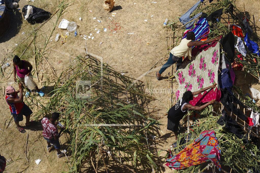 Eric Gay Haitian migrants set up make-shift camp along the Rio Grande after crossing into the United States from Mexico, Friday, Sept. 17, 2021, in Del Rio, Texas. (AP Photo/Eric Gay)