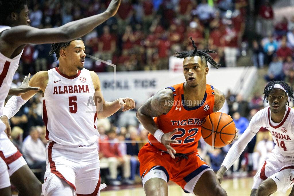 Vasha Hunt Auburn guard Allen Flanigan (22) works inside against Alabama guard Jaden Shackelford (5) during the first half of an NCAA college basketball game, Tuesday, Jan. 11, 2022, in Tuscaloosa, Ala. (AP Photo/Vasha Hunt)