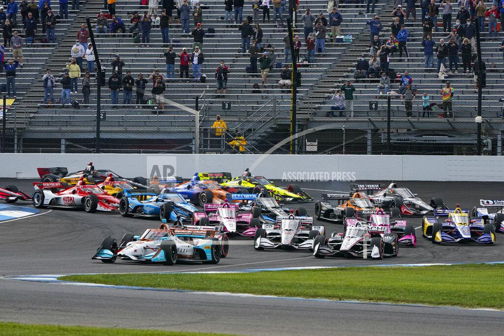 Michael Conroy Colton Herta leads the field through the first turn on the start of an IndyCar auto race at Indianapolis Motor Speedway in Indianapolis, Friday, Oct. 2, 2020. (AP Photo/Michael Conroy)
