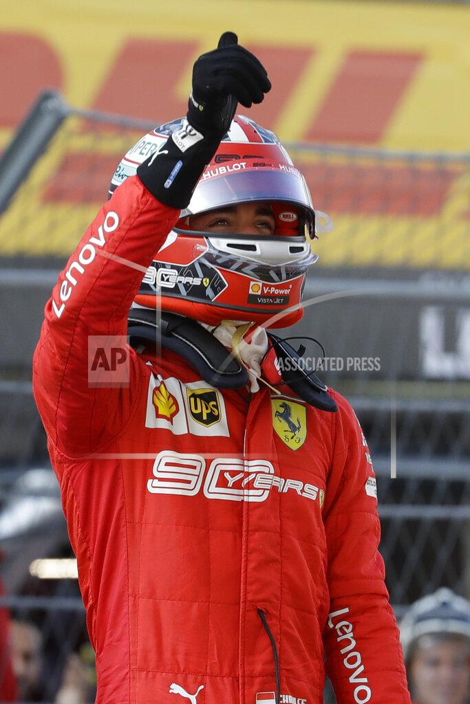 Luca Bruno Ferrari driver Charles Leclerc of Monaco celebrates after setting the pole position at the end of the qualifying session practice at the 'Sochi Autodrom' Formula One circuit, in Sochi, Russia, Saturday, Sept.28, 2019. The Formula one race will be held on Sunday. (AP Photo/Luca Bruno)