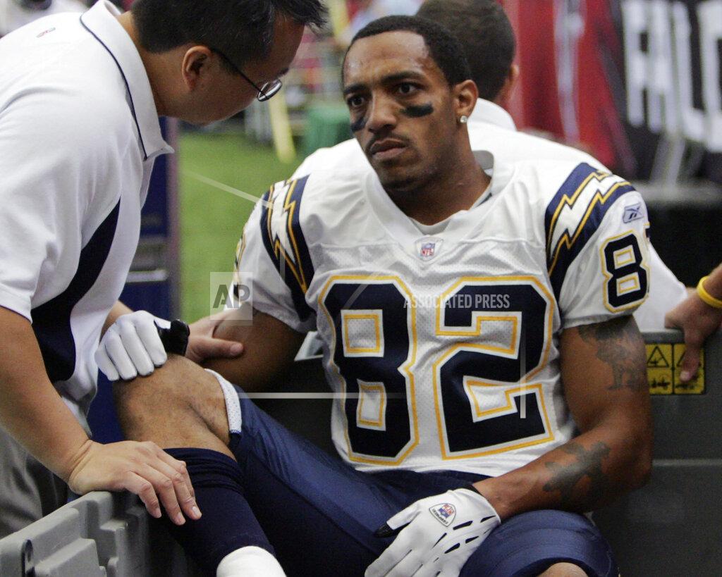 John Amis FILE - In this Oct. 17, 2004, file photo, San Diego Chargers wide receiver Reche Caldwell (82) is taken off the field during first half play against the Atlanta Falcons at the Georgia Dome in Atlanta. Caldwell, the former University of Florida and NFL receiver, was fatally shot Saturday, June 6, 2020, in his hometown. Caldwell's mother, Deborah, did not return phone messages left by The Associated Press on Sunday, but confirmed her son's death to the Tampa Bay Times. (AP Photo/John Amis, File)