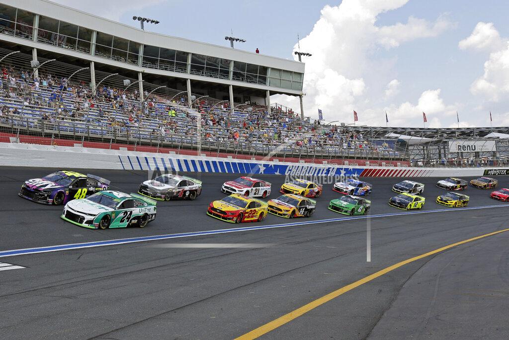 Gerry Broome William Byron (24) and Jimmie Johnson (48) lead the field of cars through Turn 4 to start a NASCAR Cup Series auto race at Charlotte Motor Speedway in Concord, N.C., Sunday, Sept. 29, 2019. (AP Photo/Gerry Broome)