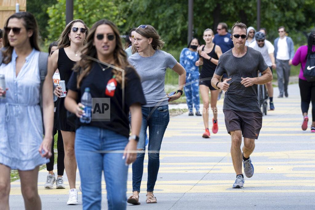 Ben Gray People go massless on the Atlanta Beltline on Friday, May 14, 2021, after the CDC updated their mask guidelines for COVID-19 vaccinated people. (AP Photo/Ben Gray)