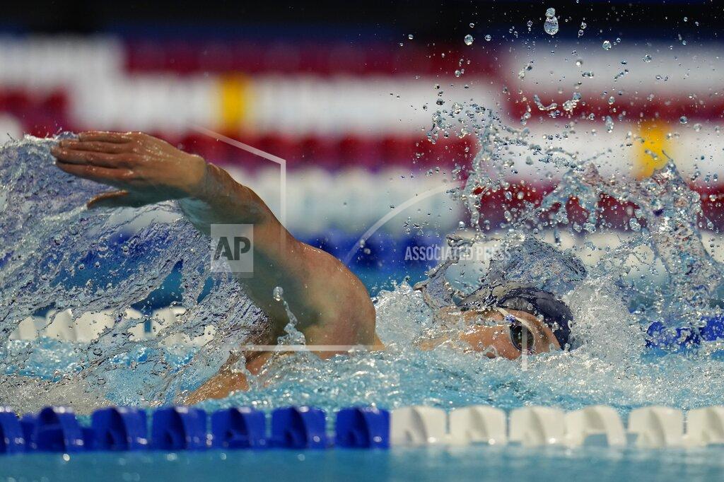 Jake Mitchell participates in a lone men's 400 freestyle qualifying heat during wave 2 of the U.S. Olympic Swim Trials on Tuesday, June 15, 2021, in Omaha, Neb. (AP Photo/Jeff Roberson)