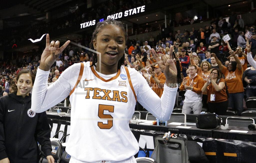 Young Kwak FILE - Texas forward DeYona Gaston (5) reacts after a college basketball game against Ohio State in the Sweet 16 round of the NCAA tournament, Friday, March 25, 2022, in Spokane, Wash. Texas won 66-63. Texas is ranked No. 3 in The Associated Press Top 25 women's preseason basketball poll released Tuesday, Oct. 18, 2022.(AP Photo/Young Kwak, File)