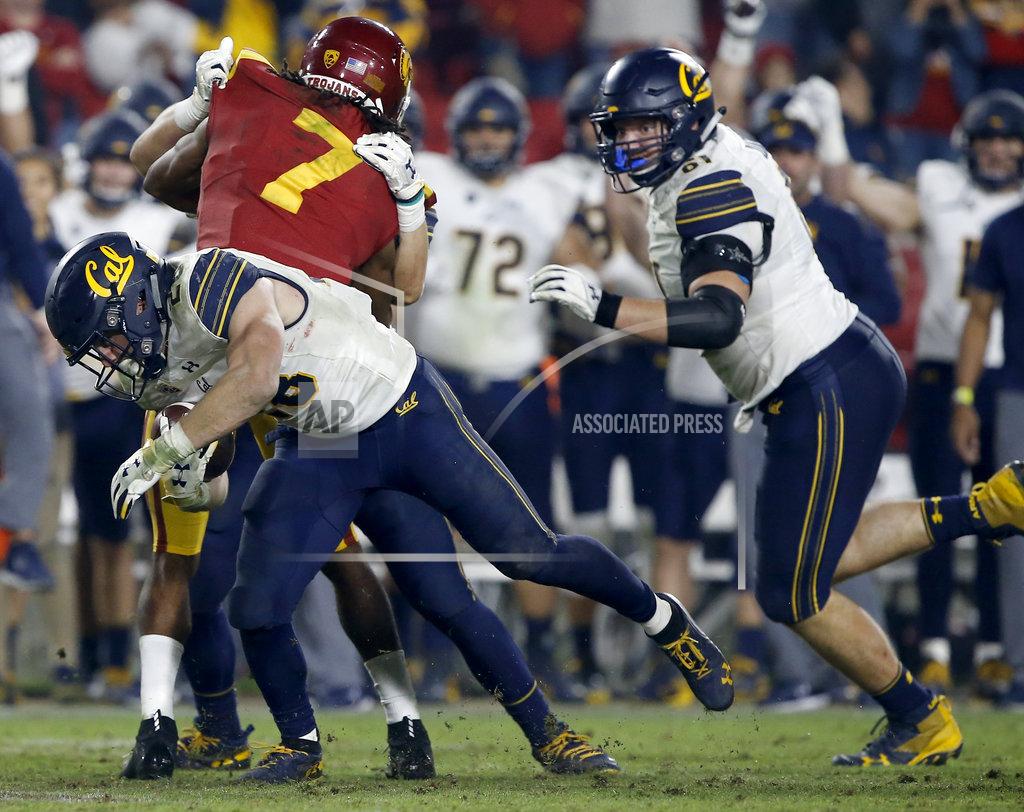 Alex Gallardo California running back Patrick Laird, left, runs for a first down on fourth-and-one, as Southern California safety Marvell Tell III (7) gets blocked during the second half of an NCAA college football game in Los Angeles, Saturday, Nov. 10, 2018. California won 15-14. (AP Photo/Alex Gallardo)