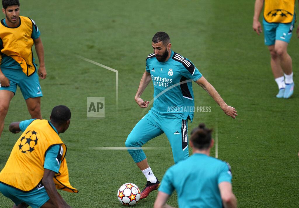 Manu Fernandez Real Madrid's Karim Benzema, centre, controls the ball during a Media Opening day training session in Madrid, Spain, Tuesday, May 24, 2022. Real Madrid will play Liverpool in Saturday's Champions League soccer final in Paris. (AP Photo/Manu Fernandez)