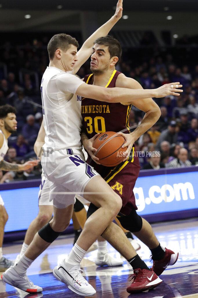 Nam Y. Huh Minnesota forward Alihan Demir, right, drives against Northwestern forward Robbie Beran during the first half of an NCAA college basketball game in Evanston, Ill., Sunday, Feb. 23, 2020. (AP Photo/Nam Y. Huh)