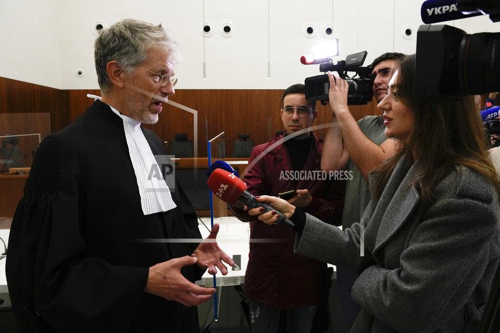 Peter Dejong Gert-Jan van den Bergh, lawyer for Ukraine, reacts after the verdict in a Dutch appeals court in Amsterdam, Tuesday Oct. 26, 2021, on ownership of a trove of Crimean historical artifacts that were loaned to an Amsterdam museum shortly before Russia annexed the region. A lower court ruled in 2016 that the treasures should be handed to the Ukrainian government. (AP Photo/Peter Dejong)