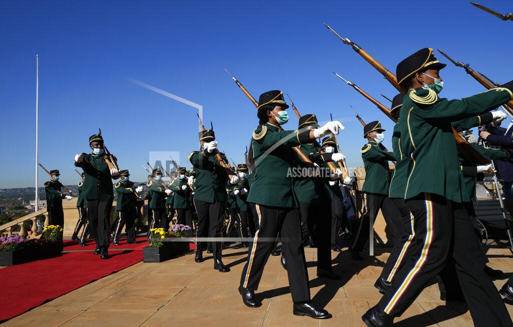 Themba Hadebe Presidential guards parade during the official welcoming ceremony of German Chancellor Olaf Scholz at the Union Building in Pretoria, South Africa, Tuesday, May 24, 2022. (AP Photo/Themba Hadebe)