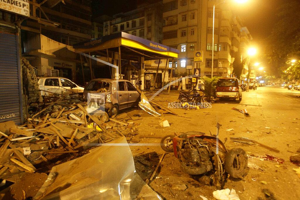 Gautam Singh FILE - In this Wednesday, Nov. 26, 2008 file photo, debris lies scattered in the street at the site of a blast in Coilaba, a market in downtown Mumbai, India, one of several attacks throughout the city. (AP Photo/Gautam Singh)