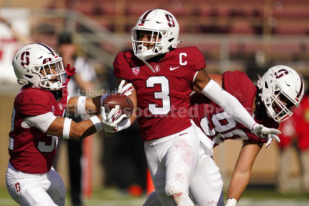 Stanford safety Malik Antoine (3) celebrates with teammates after intercepting a pass against Colorado during the first half of an NCAA college football game in Stanford, Calif., Saturday, Nov. 14, 2020. (AP Photo/Jeff Chiu)