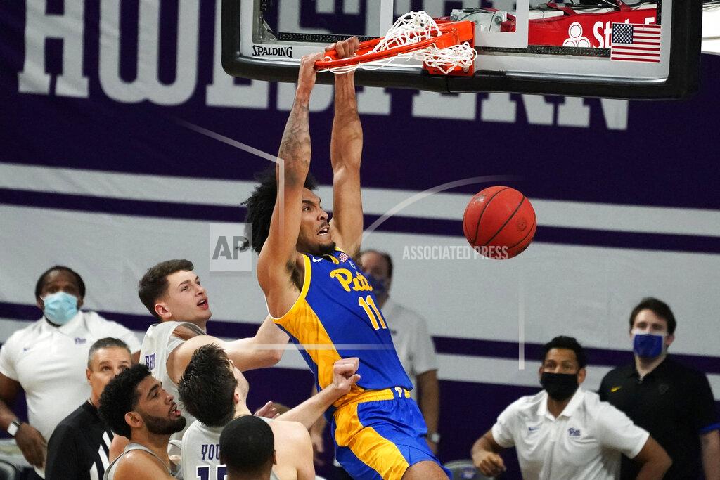 Nam Y. Huh Pittsburgh's Justin Champagnie (11) dunks against Northwestern during the second half of an NCAA college basketball game in Evanston, Ill., Wednesday, Dec. 9, 2020. (AP Photo/Nam Y. Huh)