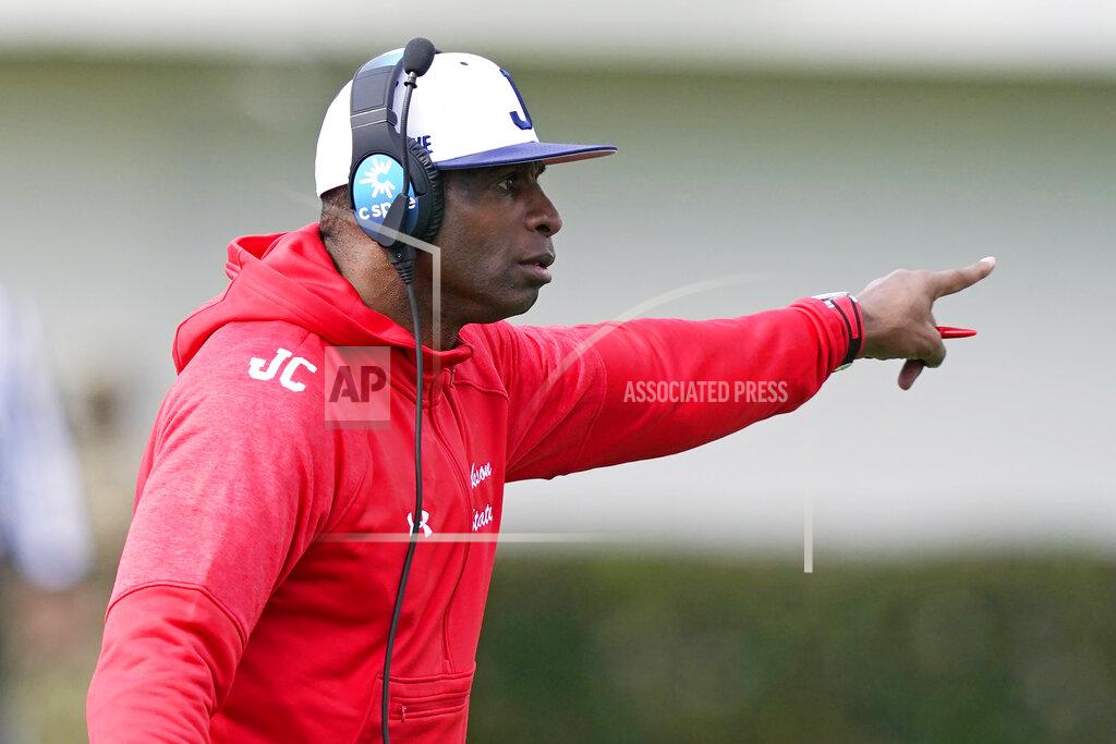 Rogelio V. Solis Jackson State football coach Deion Sanders calls out to his players during the first half of an NCAA college football against Edward Waters in Jackson, Miss., Sunday, Feb. 21, 2021. The game marks Sanders's collegiate head coaching debut. (AP Photo/Rogelio V. Solis)