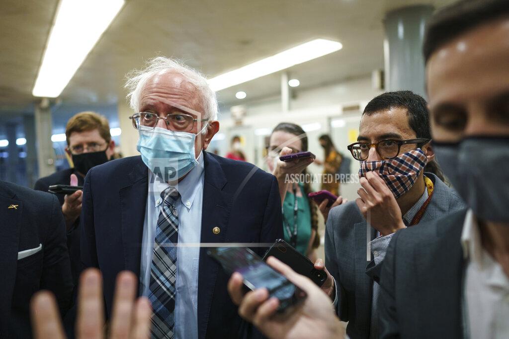 J. Scott Applewhite Sen. Bernie Sanders, I-Vt., chair of the Senate Budget Committee, is met by reporters during the vote to start work on a nearly $1 trillion bipartisan infrastructure package, at the Capitol in Washington, Wednesday, July 28, 2021. (AP Photo/J. Scott Applewhite)