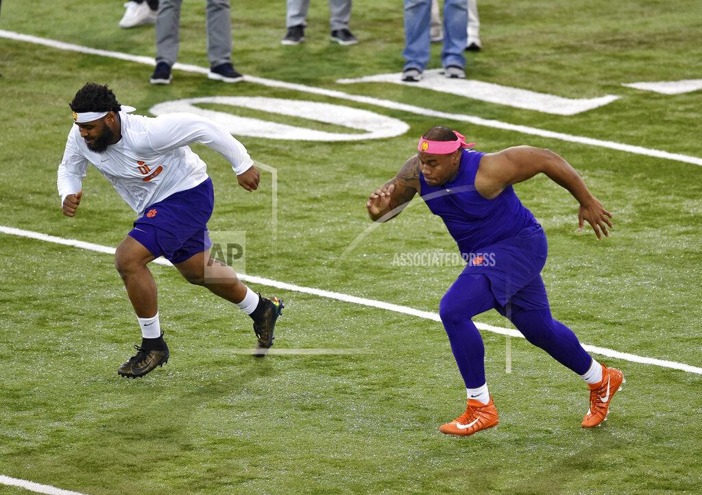 Richard Shiro Clemson's Dexter Lawrence, right, and Christian Wilkins runs drills during NFL Pro Day Thursday, March 14, 2019, in Clemson, S.C. (AP Photo/Richard Shiro)