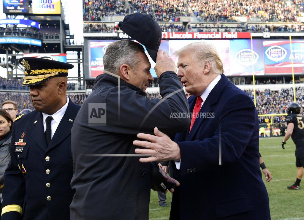 Susan Walsh President Donald Trump, right, greets Army coach Jeff Monken before the Army-Navy NCAA college football game in Philadelphia, Saturday, Dec. 8, 2018. (AP Photo/Susan Walsh)