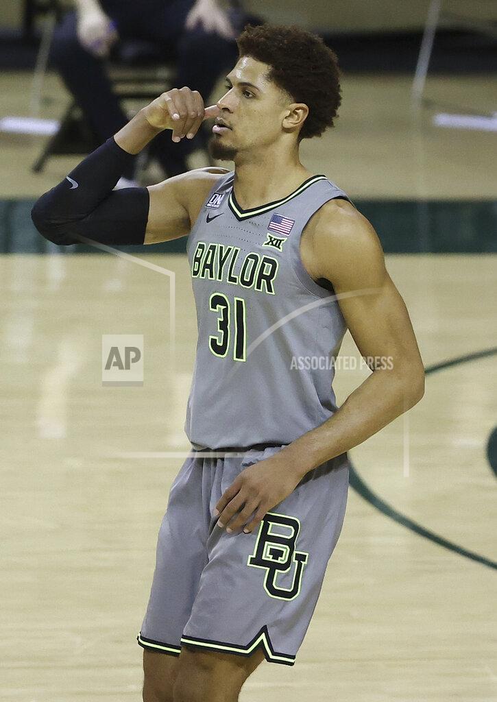Jerry Larson Baylor guard MaCio Teague (31) celebrates after shooting a 3-point shot in the second half of an NCAA college basketball game against Texas Tech Sunday, March 7, 2021, in Waco, Texas. (AP Photo/Jerry Larson)