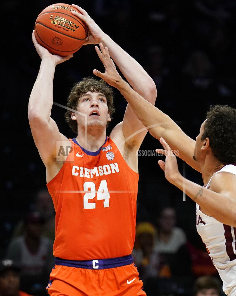John Minchillo Clemson Tigers' PJ Hall (24) shoots for three points in the first half of an NCAA college basketball game against the Virginia Tech during the Atlantic Coast Conference men's tournament, Wednesday, March 9, 2022, in New York. (AP Photo/John Minchillo)