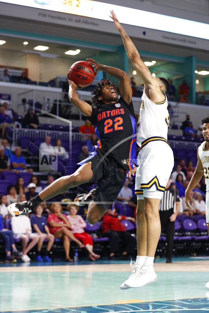 Scott Audette Florida guard Tyree Appleby (22) drives to the basket against California guard Jordan Shepherd (31) during the first half of an NCAA college basketball game Monday, Nov. 22, 2021, in Fort Myers, Fla. (AP Photo/Scott Audette)