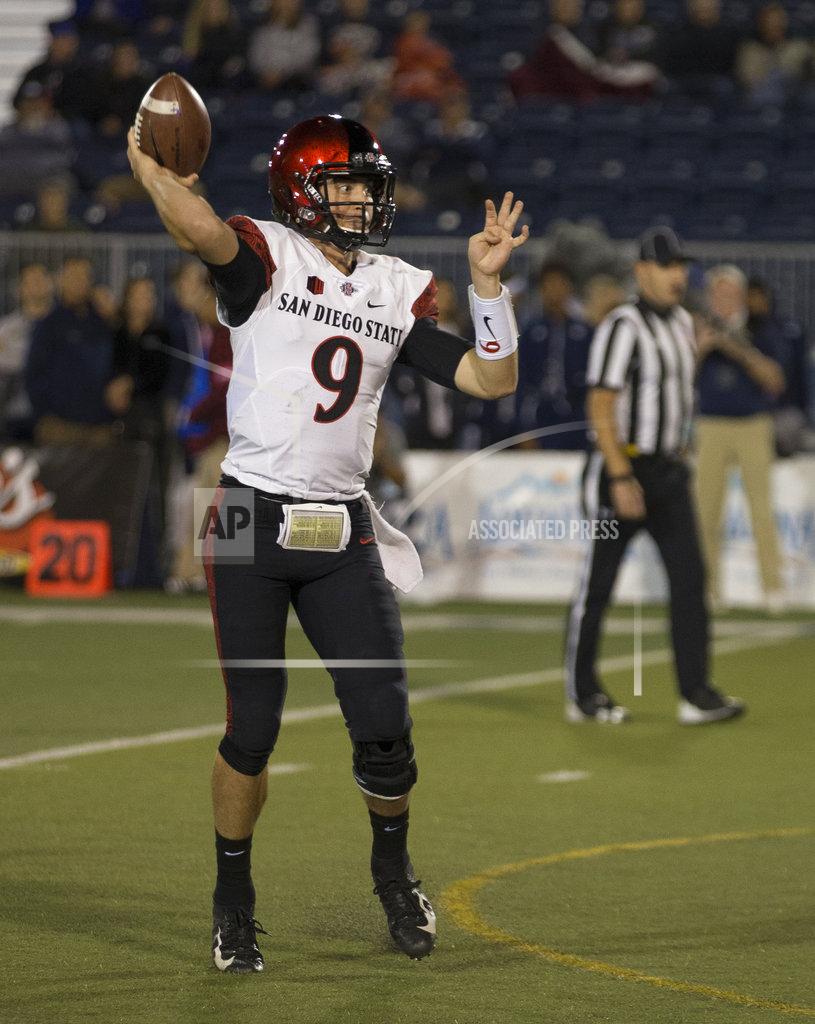 Tom R. Smedes San Diego State quarterback (9) throws a touchdown against Nevada in the first half of an NCAA college football game in Reno, Nev., Saturday, Oct. 27, 2018. (AP Photo/Tom R. Smedes)