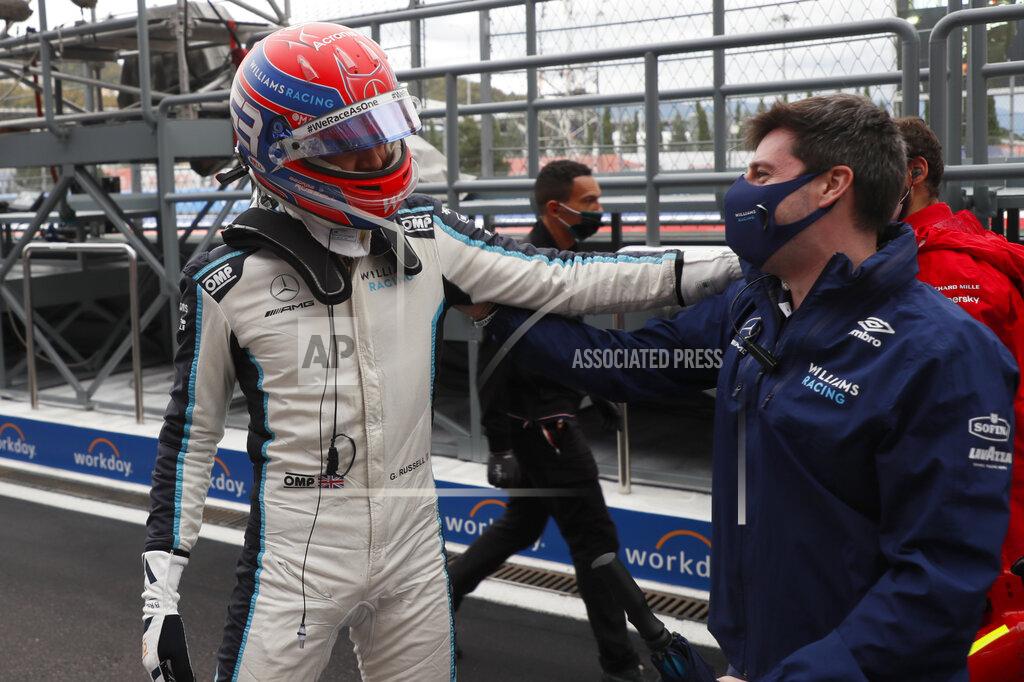 Yuri Kochetkov British Formula One driver George Russell of Williams Racing reacts after taking the third position in the qualifying session of the 2021 Formula One Grand Prix of Russia at the Sochi Autodrom race track in Sochi, Russia, Saturday, Sept. 25, 2021. The Russian Formula One Grand Prix will be held on Sunday. (Yuri Kochetkov/Pool Photo via AP)