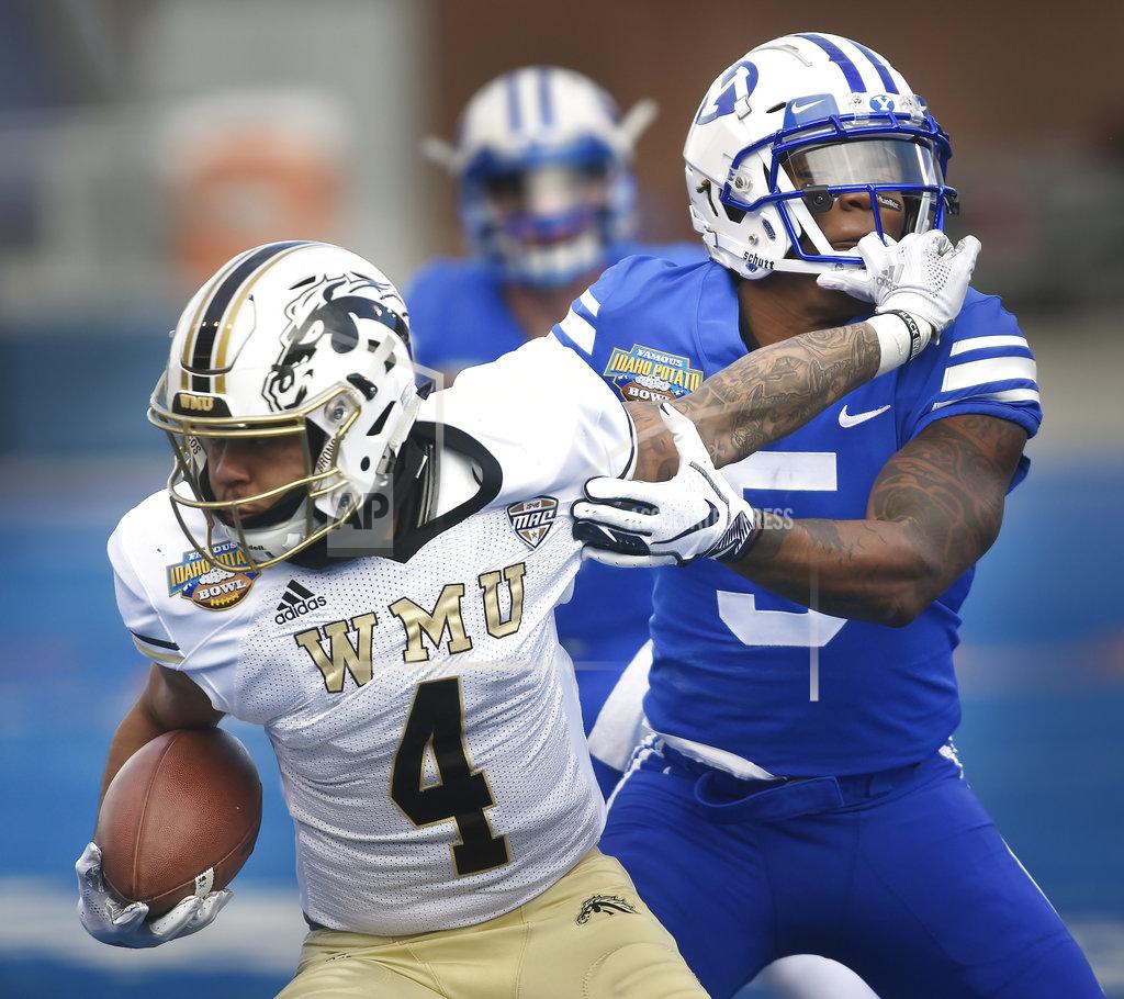 Drew Nash Western Michigan defensive back Patrick Lupro (4) carries the ball while BYU defensive back Dayan Ghanwoloku (5) works to bring him down during the Famous Idaho Potato Bowl NCAA college football game Friday, Dec. 21, 2018, in Boise, Idaho. (Drew Nash/The Times-News via AP)