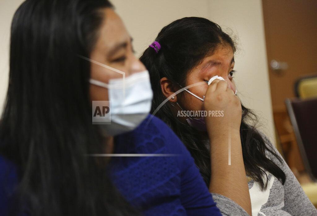 Jessie Wardarski Stephany Martinez wipes tears from her eyes as she talks about losing her grandparents to the coronavirus, while sitting next to her mother, Reyna Martinez, at Our Lady of Sorrows Roman Catholic church in the Queens borough of New York on Friday, March 5, 2021. Both are parishioners of the church. (AP Photo/Jessie Wardarski)
