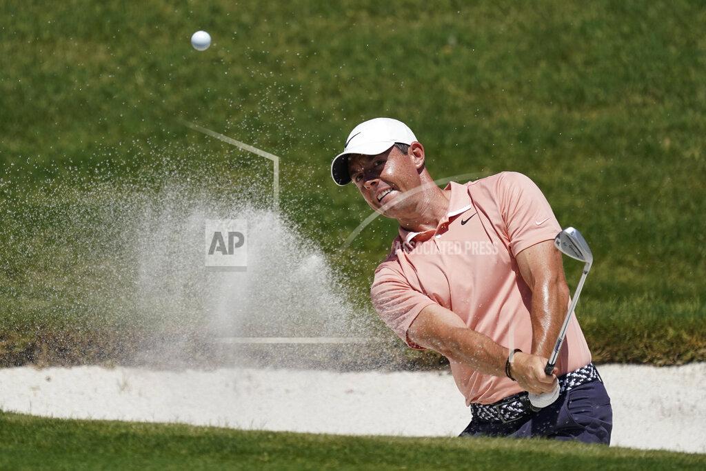 David J. Phillip Rory McIlroy, of Northern Ireland, chips into the hole for a birdie on the 16th green during the final round of the Charles Schwab Challenge golf tournament at the Colonial Country Club in Fort Worth, Texas, Sunday, June 14, 2020. (AP Photo/David J. Phillip)