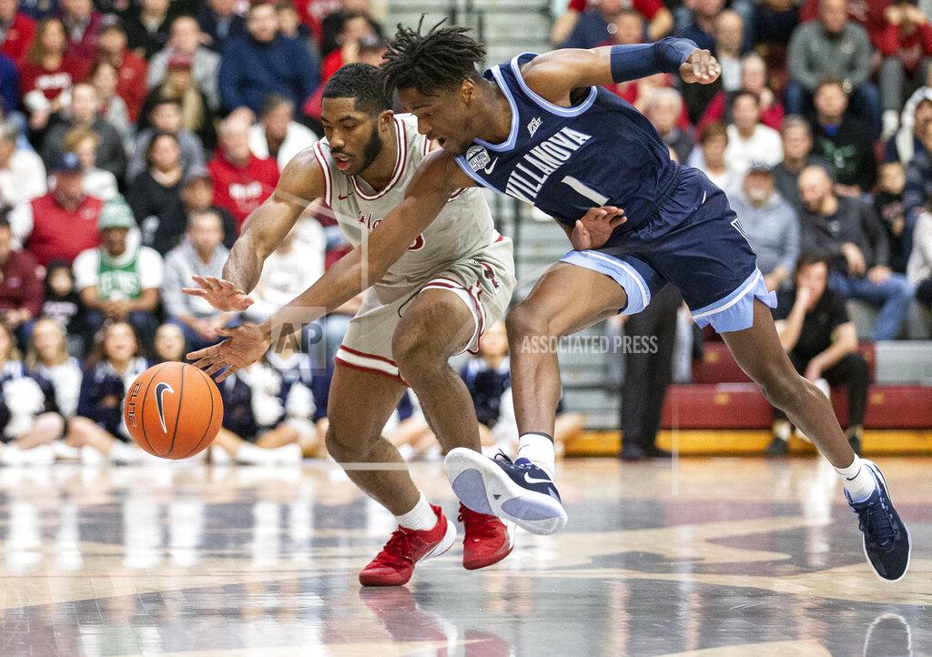 Laurence Kesterson Villanova guard Bryan Antoine (1) and Saint Joseph's guard Rahmir Moore (10) chase a loose ball in the first half of an NCAA college basketball game, Saturday, Dec. 7, 2019, in Philadelphia. (AP Photo/Laurence Kesterson)